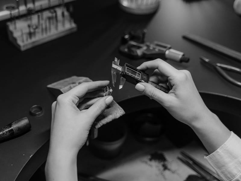 Jeweler measuring a ring with a digital caliper