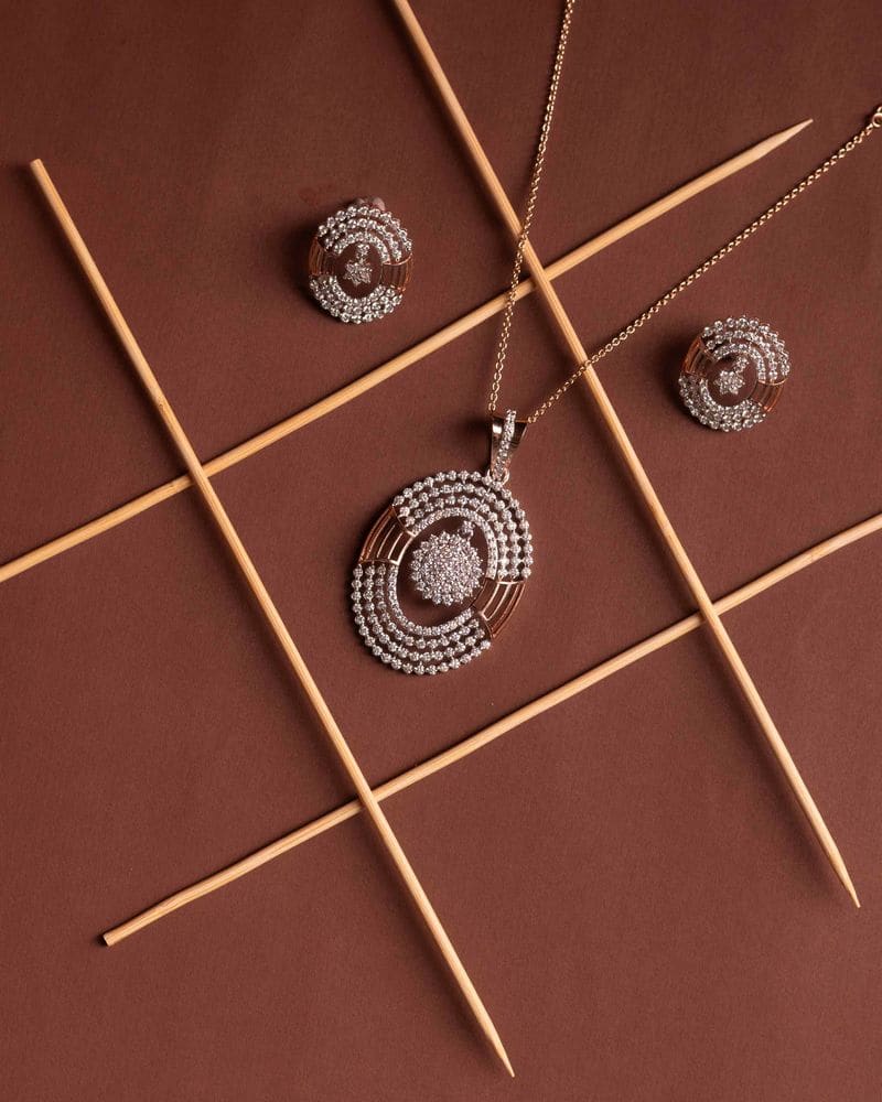 Diamond halo pendant and studs
