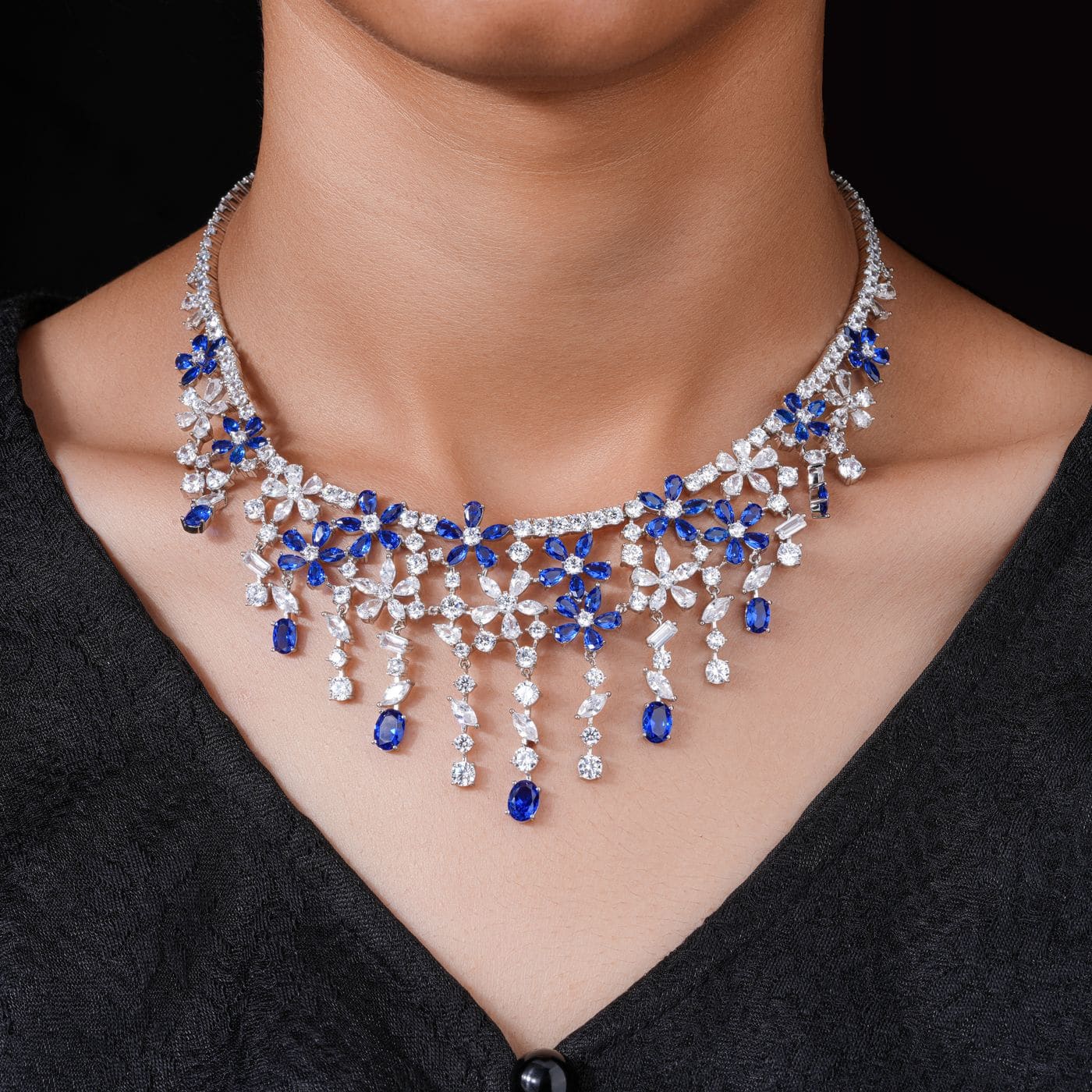 Diamond jewelry arranged on black velvet