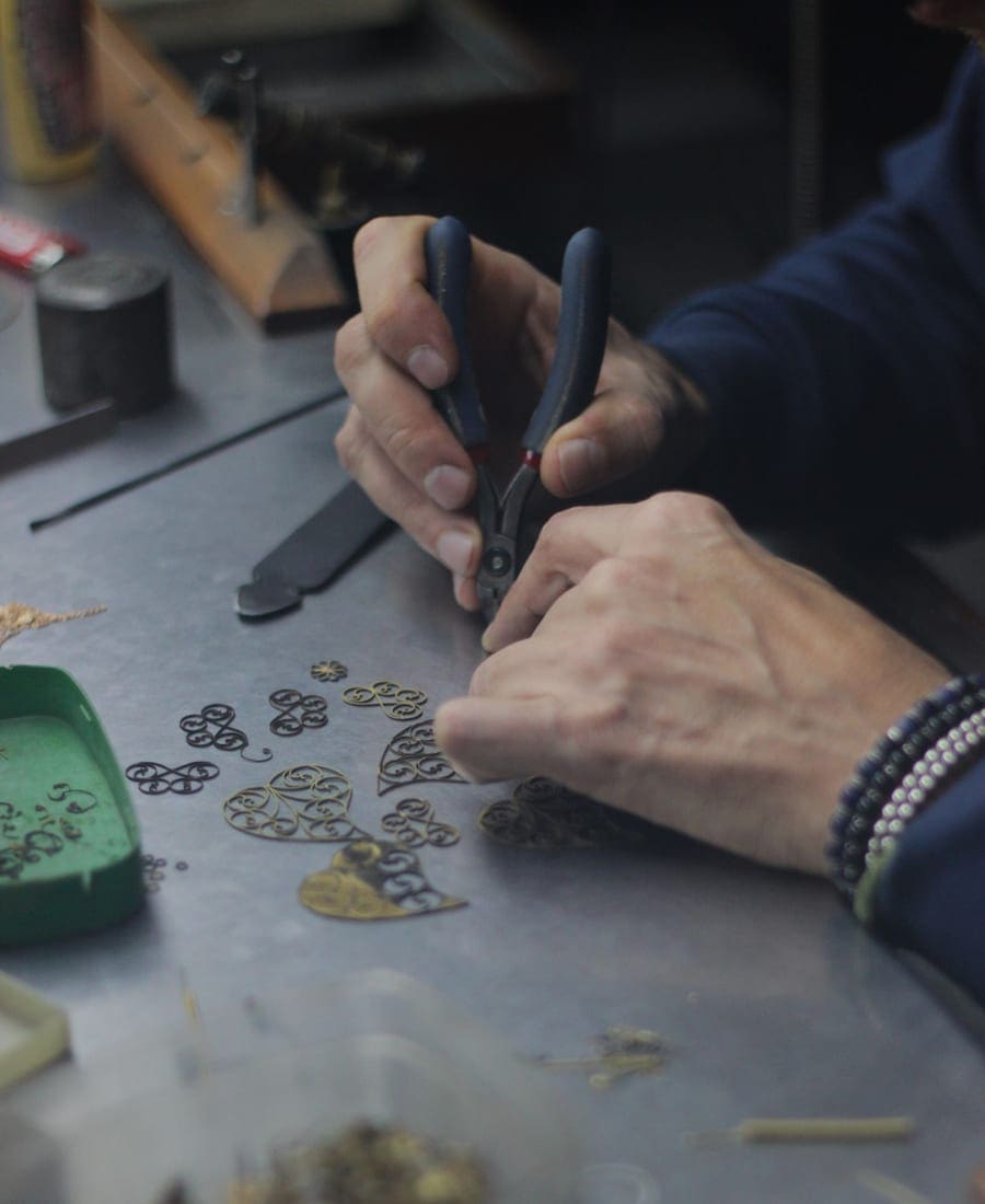 Jeweler inspecting a ring setting at the bench