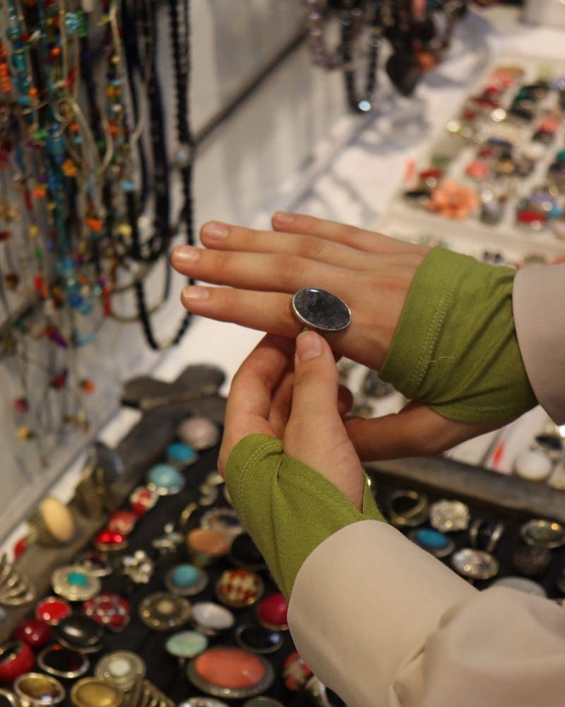 Client trying on a ring at a jewelry counter